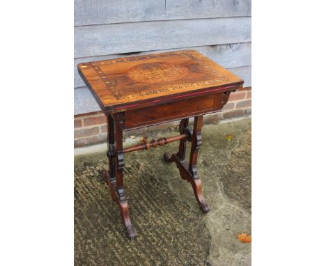 A late 19th century rosewood, burr maple and birch inlaid fold-over top card table, fitted frieze drawer, on twin panel end s