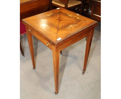 An Edwardian rosewood, line inlaid and marquetry envelope card table, inset single drawer, on square tapered castored support