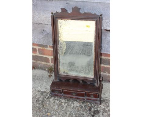 An early Georgian mahogany toilet mirror, on plateau base, fitted three drawers, on bracket feet, 15" wide x 8" deep x 25" hi