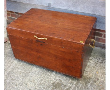 A stained pine hinged trunk with brass handles, 35" wide