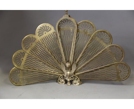 A brass peacock firescreen with pierced decoration, 25 1/4" high 