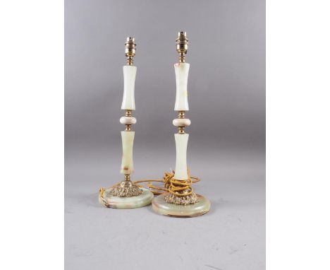 A pair of turned onyx and gilt metal mounted table lamps, on circular bases, 18" high overall, and a similar standard lamp wi