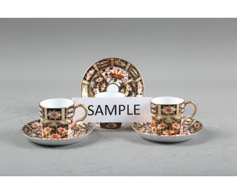 A set of twelve Royal Crown Derby Imari 2451 pattern coffee cans and saucers 