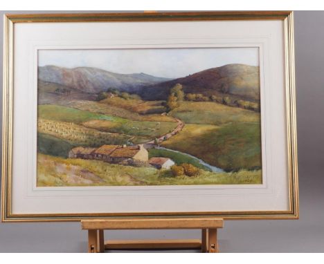 R C Riseley, 1928: watercolours, valley landscape with cattle, 12" x 20", in wash line mount and gilt frame 
