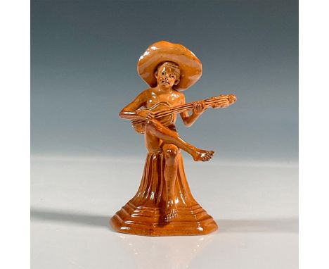 Stoneware salt glazed figure of Merry Musicians series. Modeled as a boy seated on a tapering plinth playing an instrument. I