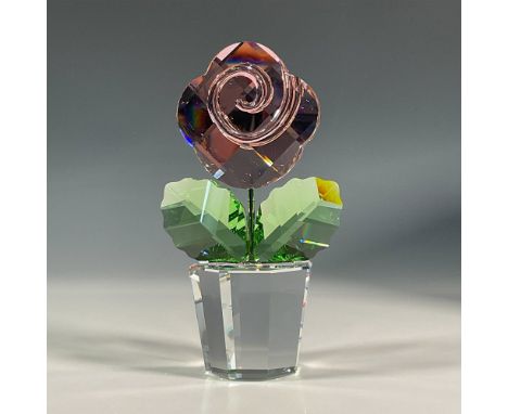 One of a kind, lead crystal flower that was part of the Happy Flowers collection. It features a clear pot, peridot green leav