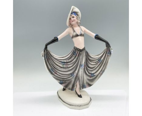 A figure of a dancer in a gray skirt with pink and blue flowers, and a plain gray hat and bikini top. Goldscheider stamped. 6