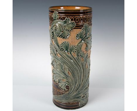 An impressive cylindrical form vase featuring an Art Nouveau style foliate relief, and floral starburst like pattern impresse