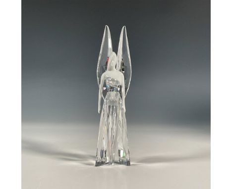 Exquisite angel made with a clear crystal dress and harmonized wings. Her upper body and face are of glazed porcelain. Swarov