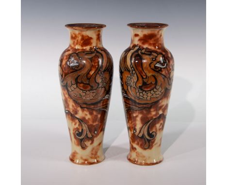 Two beautiful glazed vases decorated in a tan and tawny-brown pigment brush-line. The vases depicts fierce grotesque mythical