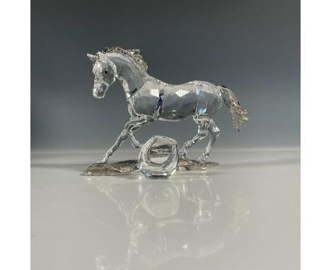 Annual edition piece made from clear crystal with satin crystal mane and tail. Plaque is engraved with figure title and artis