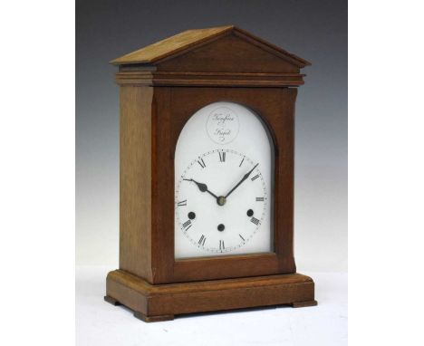 20th Century mahogany-cased chiming bracket or mantel clock with white Roman dial and 'Tempus Fugit' medallion, three-train m