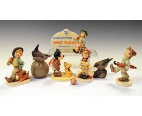 Hummel advertising plaque and three figures, together with two Poole pottery bird figures by Barbara Linley Adams, 13cm high