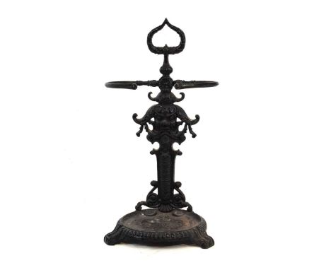 Cast iron stick stand, having mask and floral decoration, 48cm x 90cm high approx. 