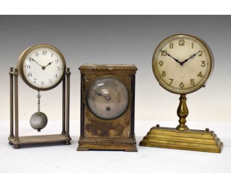 Three early 20th Century silver-plated mantel clocks comprising an 8-day example modelled in the style of a 'mystery clock' b