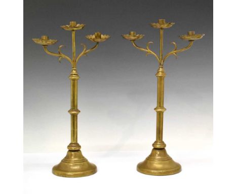 Pair of Ecclesiastical style brass candelabra of two branch design, 48cm high