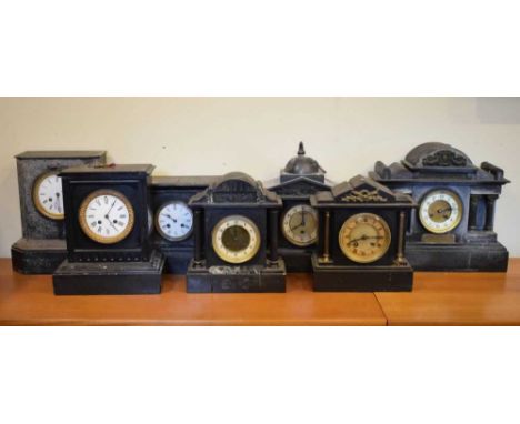 Seven assorted French black slate mantel clocks to include 'temple' and other architectural examples, 33cm high and smaller, 