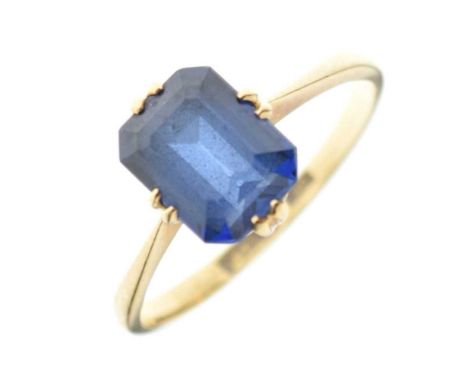 '18ct' yellow metal and synthetic sapphire ring, the canted oblong stone 8mm x 6mm approx, size R, 3.1g gross approx