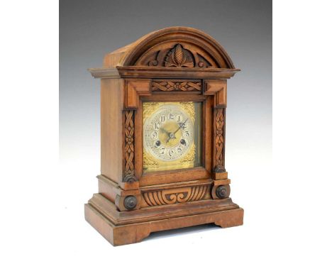 German carved walnut bracket clock with silvered cellular Arabic chapter ring, two-train movement striking on a coiled posted