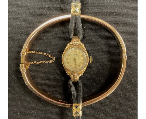 A 9ct rose gold hinge bangle, 10g;  Rotary 9ct gold cased lady's wristwatch, 10.8g gross (2) 