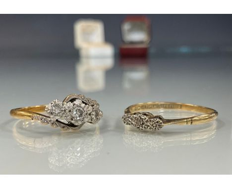 An 18ct gold diamond twist crest ring, set with three round brilliant cut diamonds, 3g gross;  another single stone, 9ct gold