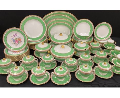 A Spode green and gilt dinner service for twelve including; a set of four graduated meta dishes, twelve dinner plates, twelve