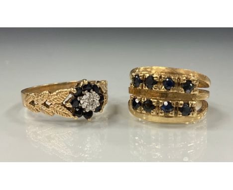 A diamond and sapphire floral ring, 9ct gold shank, size P;  another sapphire eight stone ring, 9ct gold shank, size I, 8.3g 