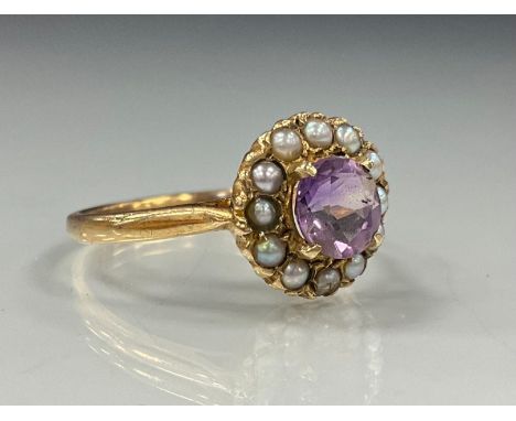 An pale pinky purple amethyst and seed pearl ring, 9ct gold shank, stamped 9ct, size Q/R, 2.5g gross 