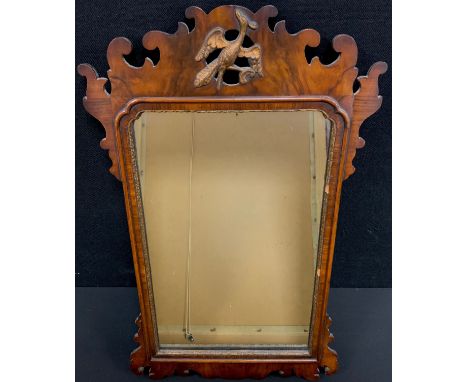 A 19th century walnut Vauxhall Mirror, gilt bird crest, 72.5cm x 43cm. 