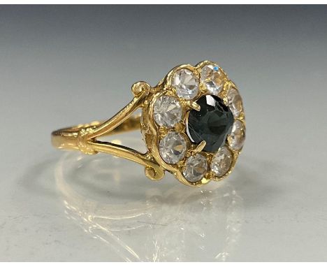 A Cz sapphire and diamond effect dress ring, unmarked yellow metal shank, size P, 4.6g gross 