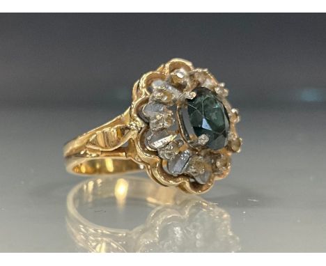 A green and white stone dress ring, yellow metal shank, stamped 585, Y68, size O, 4.1g gross 