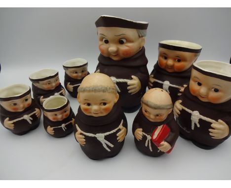 9 GOEBEL MONKS INCLUDING 7 GRADUATED JUGS, CONDIMENT POT AND PEPPER POT A/F