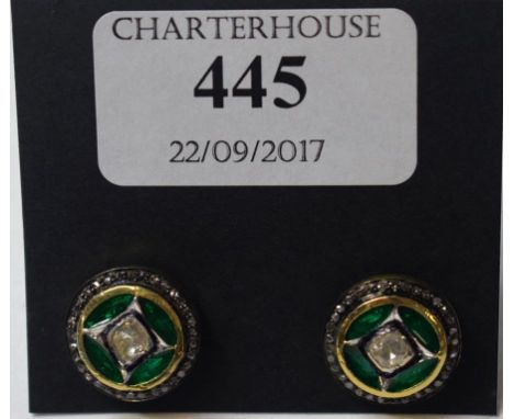 A pair of 9ct gold target stud earrings, each set a central diamond, within green enamel and a diamond halo   Condition repor