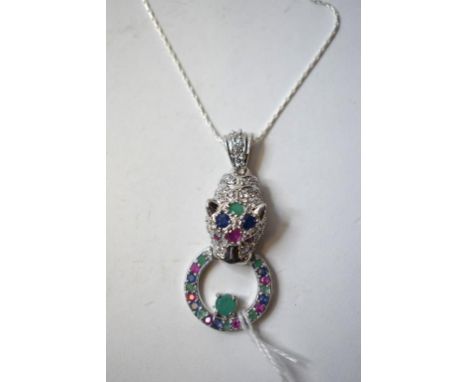 A silver, ruby, emerald and sapphire panther necklace, with matching earrings