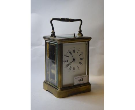 A late 19th century carriage clock, with repeat, the 6.5 cm wide enamel dial with Roman numerals, fitted an eight day movemen