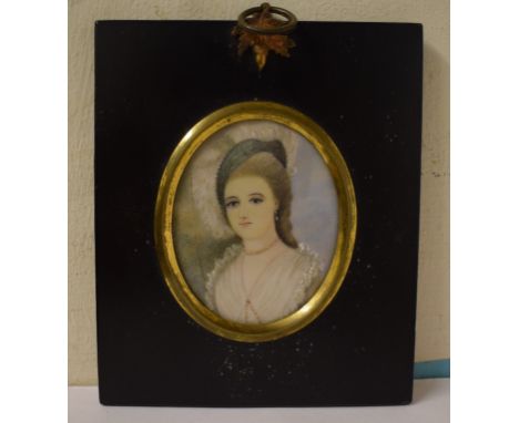 An oval bust portrait miniature, of a lady, 7.5 x 6 cm, other miniatures, a geometry set, a key, and other items (box)