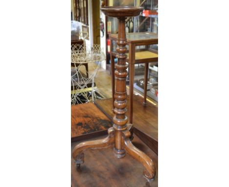 An oak candlestand, on a tripod base, 85 cm high