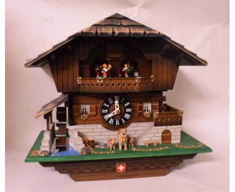 A Swiss automaton clock, 34 cm wide, an Art Deco style figure, a Royal Doulton vase, assorted designer leather wallets and ot