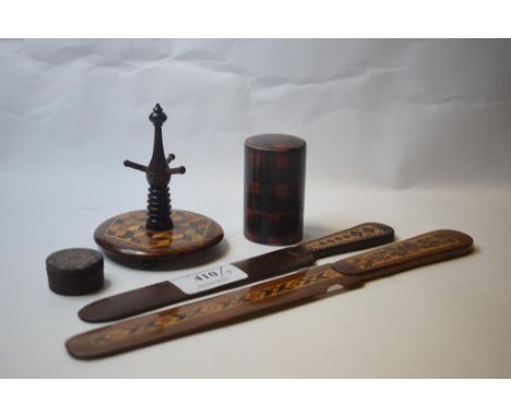 A Tunbridge ware page turner, another similar, a similar ring stand, a pill box, and a tartan ware box and cover (5) 