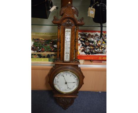 A late Victorian aneroid barometer, in an oak case, 90 cm high, a letter rack, a Canterbury, a bed warming pan, assorted pict