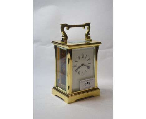A carriage timepiece, the white enamel dial signed Searle & Co Ltd Royal Exchange London, with Roman numerals, in a four pill