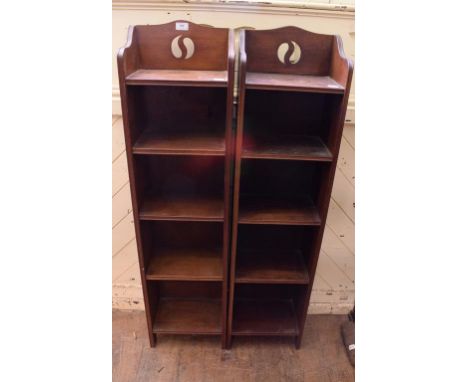 A pair of Arts & Crafts narrow oak bookcases, with pierced motifs, 32 cm wide (2)   Condition report  Report by GHSome age re