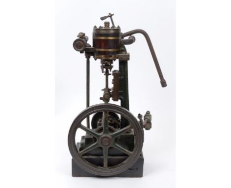 A large scratch built vertical steam engine, with 24 cm diameter fly wheel, coopered cylinder barrel, cast iron structure and