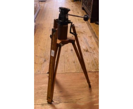 An Edwardian folding wood half plate camera, with two half plate slides, a Taylor & Hobson Cooke lens, 8 x 5 inches, focus 9.