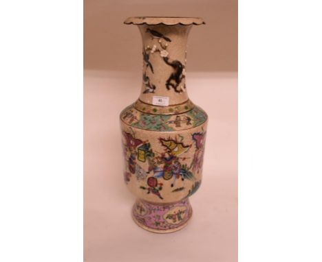 A large Chinese pottery vase, decorated in enamel colours, 57 cm high, and a carved green hardstone horse head, on a wooden b
