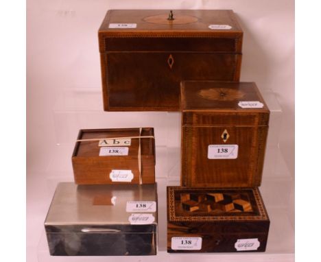 A 19th century inlaid mahogany tea caddy, 20 cm wide, three other wooden boxes, and a silver table top cigarette box, with en