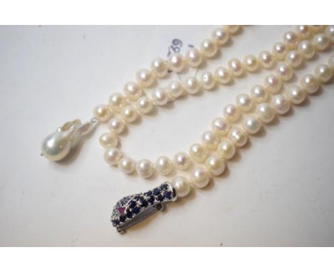 A silver and sapphire snake pearl necklace, with ruby eyes
