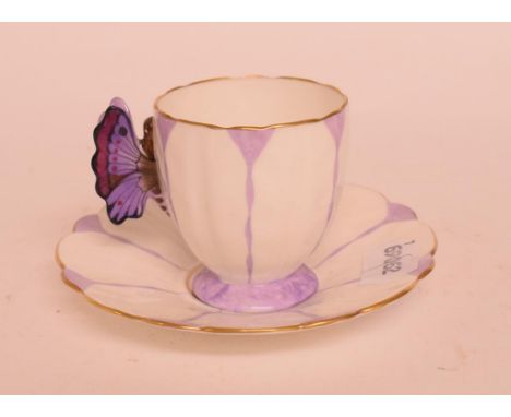 An Aynsley cup and saucer, the handle in the form of a butterfly, with violet decoration, a Minton blue and white dish, a pai