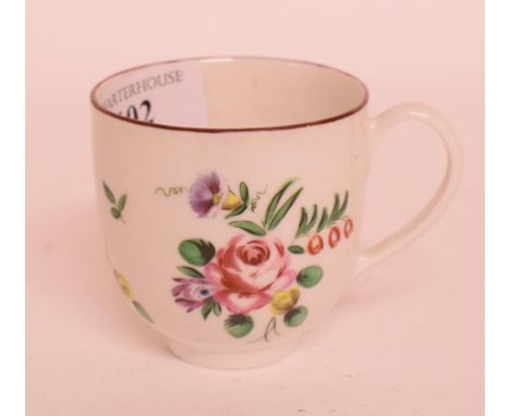 A late 18th century Bristol porcelain coffee cup, decorated flowers in enamel colours, 6 cm high   Condition report  Report b