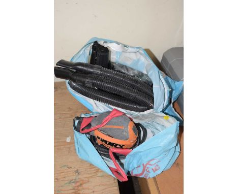 Small electric sander and a quantity of vacuum cleaner attachments